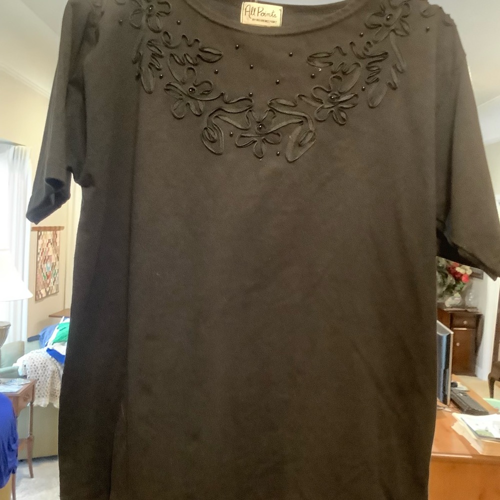 Black knit top from All Points by Reference Point.